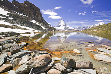 The Matterhorn reflected in a mountain lake above Zermatt Switzerland, Europe