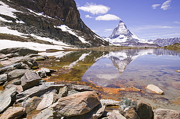 The Matterhorn reflected in a mountain lake above Zermatt Switzerland, Europe