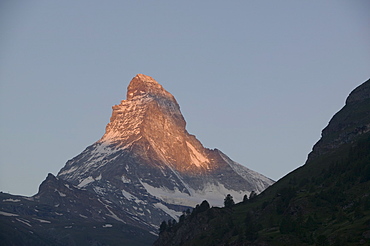 First light on the Matterhorn above Zermatt Switzerland, Europe