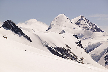 Climbers descending the Breithorn above Zermatt, Switzerland, Europe