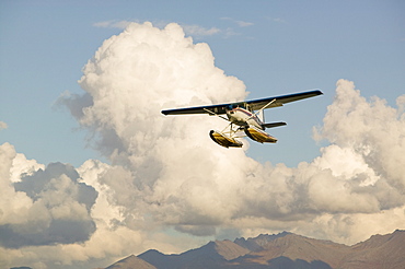 A float plane flying into Anchorage, Alaska, United States of America, North America