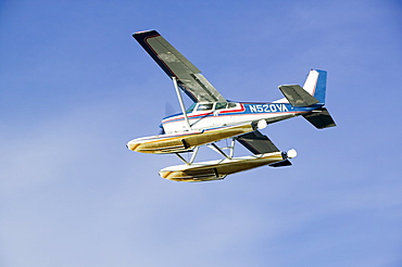 A float plane flying into Anchorage, Alaska, United States of America, North America