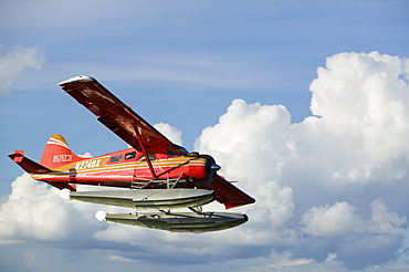 A float plane flying into Anchorage, Alaska, United States of America, North America