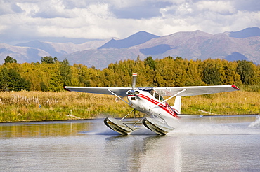 A float plane flying into Anchorage, Alaska, United States of America, North America