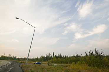 A lamp post collapsing due to global warming-induced permafrost melt, in Fairbanks, Alaska, United States of America, North America