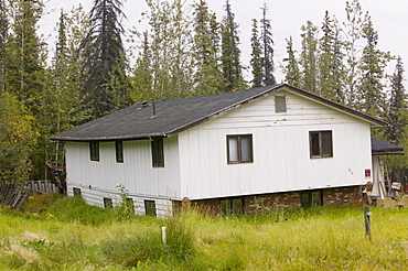 House collapsing due to global warming-induced permafrost melt, Fairbanks, Alaska, United States of America, North America