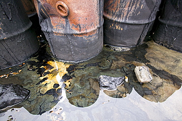 Abandoned barrels of leaking waste oil on the tundra at Nome in Alaska, United States of America, North America