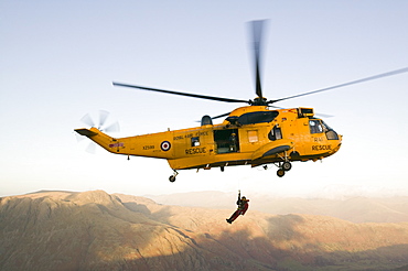 An RAF Sea King helicopter attends a mountain rescue incident in the Lake District, Cumbria, England, United Kingdom, Europe