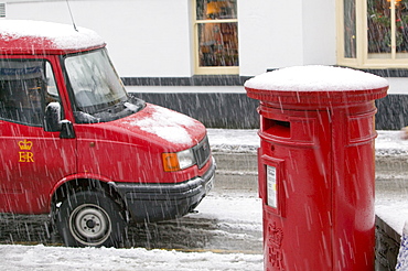 A postvan and post box in snow in Ambleside, Cumbria, England, United Kingdom, Europe