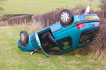 A car overturned and crashed after leaving the road near Kendal, Cumbria, England, United Kingdom, Europe