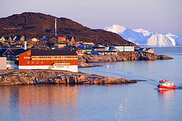 Colourful houses and hospital in Ilulissat in the midnight sun on Greenland, Polar Regions