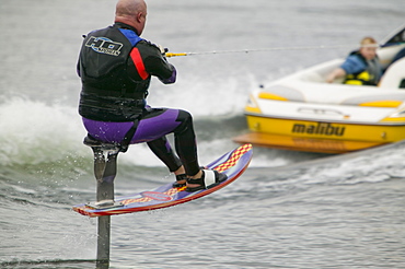 Waterskiers on Lake Windermere in the Lake District, Cumbria, England, United Kingdom, Europe