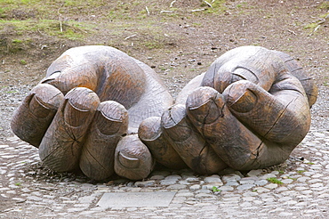 A hands sculpture on the shores of Derwentwater near Keswick in the Lake District, Cumbria, England, United Kingdom, Europe