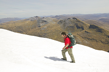 The Grey Corries from Aonach Beag with a hill walker in the snow, Scotland, United Kingdom, Europe