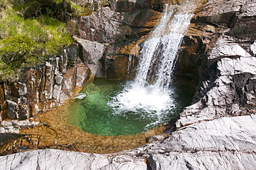 A waterfall and plunge pool on the side of Ben Starav, a Munro in the Highlands, Scotland, United Kingdom, Europe