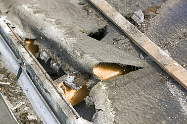 Old rotten felt on a leaking house roof