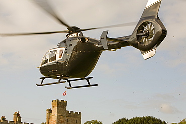 A private helicopter arriving at Narworth Castle in North Cumbria, England, United Kingdom, Europe