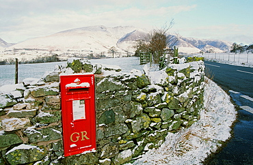 A rural postbox in St. Johns in the Vale in winter, near Keswick, Lake District, Cumbria, England, United Kingdom, Europe