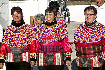 Inuit women wearing traditional Greenlandic national costume (Kalaallisuut) in Ilulissat on Greenland, Polar Regions