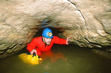 A caver in Valley Entrance, Kingsdale, Yorkshire Dales, Yorkshire, England, United Kingdom, Europe