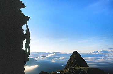 A climber on Suilven at dawn, Scotland, United Kingdom, Europe