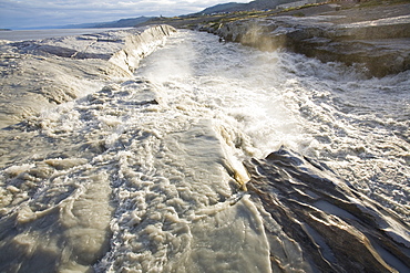 Meltwater from the Russell Glacier that drains the Greenland Ice Sheet 26 km inland from Kangerlussuaq, Greenland, Polar Regions