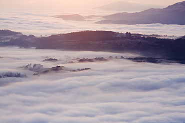 Valley mist over South Cumbria from Wansfell Pike in the Lake District National Park, Cumbria, England, United Kingdom, Europe