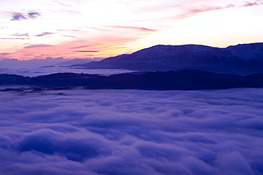 Valley mist over the Coniston Fells from Wansfell Pike in the Lake District National Park, Cumbria, England, United Kingdom, Europe