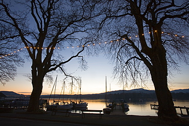 Sailing boats on Lake Windermere at sunset at Waterhead, Ambleside, Lake District, Cumbria, England, United Kingdom, Europe