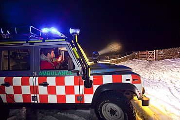 A Langdale Ambleside Mountain Rescue Team Landrover out at night below Red Screes in the Lake District, Cumbria, England, United Kingdom, Europe