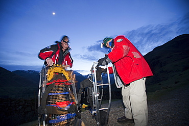 Langdale Ambleside mountain Rescue Team carry an injured walker off the Langdale Pikes at night near Ambleside, Lake District, Cumbria, England, United Kingdom, Europe