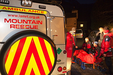 Langdale Ambleside mountain Rescue Team carry an injured walker off the Langdale Pikes at night near Ambleside, Lake District, Cumbria, England, United Kingdom, Europe