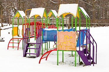 Playground swings in the snow in Ambleside, Cumbria, England, United Kingdom, Europe