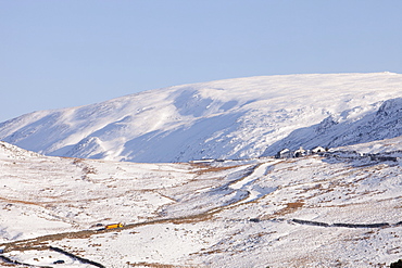 A snow plough trying to keep Kirkstone Pass open in the snow, Lake District, Cumbria, England, United Kingdom, Europe