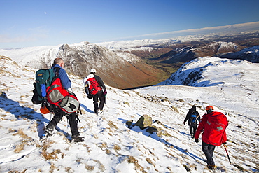 Members of Langdale Ambleside Mountain Rescue Team descend Bow Fell after treating and evacuating a seriously injured climber in the Lake District, Cumbria, England, United Kingdom, Europe