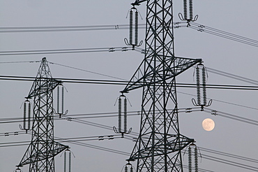 A full moon and electricity pylons in Leicestershire, England, United Kingdom, Europe