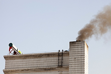 Smoke from burning coal contributes to an ever increasingly polluted atmosphere in Heilongjiang Province, Northern China, Asia