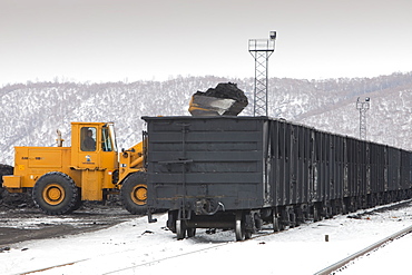 A train being loaded with low grade coal from an opencast coal mine near Heihe on the Chinese Russian border, Heilongjiang province, China, Asia