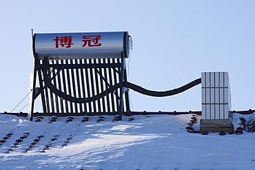 Solar water heaters on roofs of housing complex in Heilongjiang province, Northern China, Asia