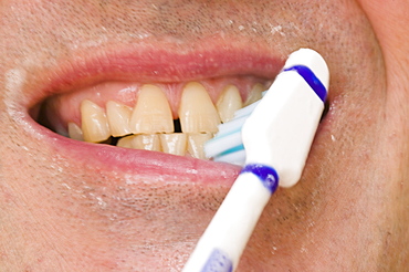 A man brushing his teeth