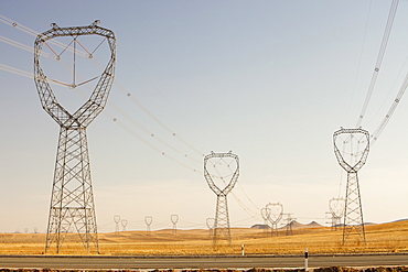 Electricity pylons march across Inner Mongolia in Northern China, Asia