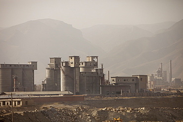 A coal fired cement factory billows smoke in Tongshuan, Shanxi Province, China, Asia