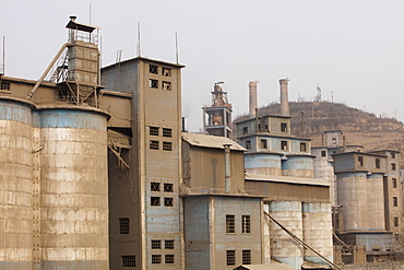 A coal fired cement factory billows smoke in Tongshuan, Shanxi Province, China, Asia