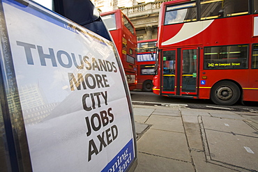 Newspaper hoarding announcing more job losses in the 2008 credit crunch, in front of The Bank of England, City of London, London, England, United Kingdom, Europe