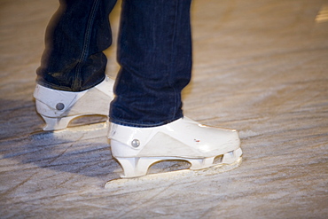 Skaters on an artificial ice rink in Lincoln city centre. Lincoln, Lincolnshire, England, United Kingdom, Europe