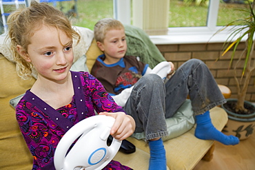 A family playing computer games on a Wii console