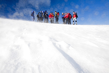 A group of mountaineers ascending Cairngorm in the Cairngorm National Park in Scotland, United Kingdom, Europe