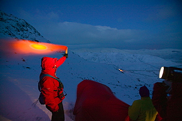 Mountain rescue team members rescue a seriously injured women from Red Screes who had fallen 300 feet in the snow, Lake District, Cumbria, England, United Kingdom, Europe