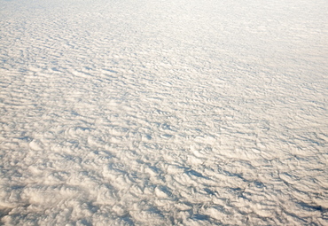 Flying over a bank of low cloud across Iran, Middle East