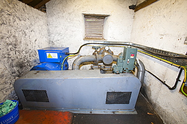 A hydro electric turbine producing green electricity in the grounds of Rydal Hall near Ambleside, Lake District, Cumbria, England, United Kingdom, Europe